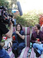 Neve Campbell and Tracy Thomas laughing